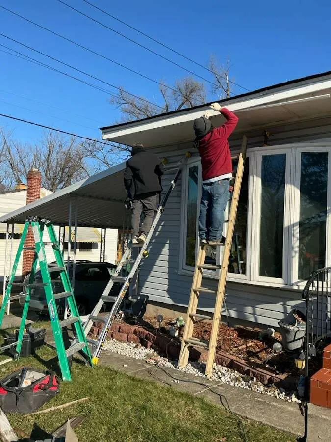Restoration crew performing exterior repair in Marlene Village